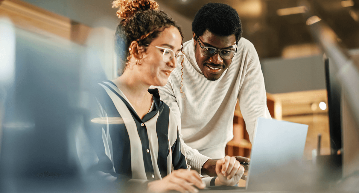 people on laptop at work