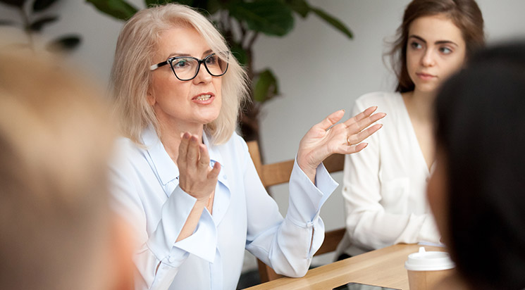 Woman  giving a talk in meeting