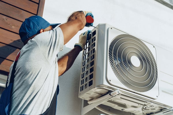 repairman-in-uniform-installing-the-outside-unit-o-2021-09-03-16-17-29-utc (1) (1) (1)