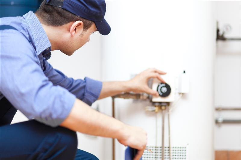 man-installing-water-heater