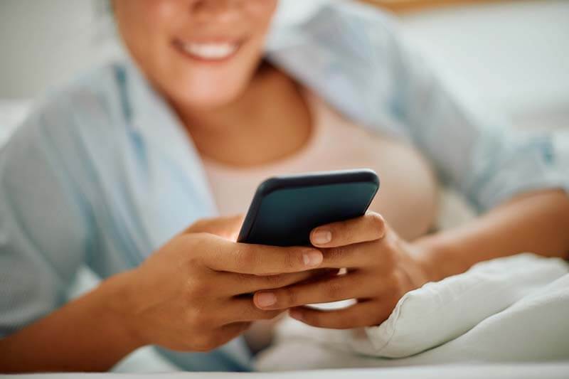 close-up-of-woman-texting-on-cell-phone